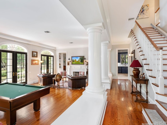 playroom with hardwood / wood-style floors, crown molding, pool table, and french doors