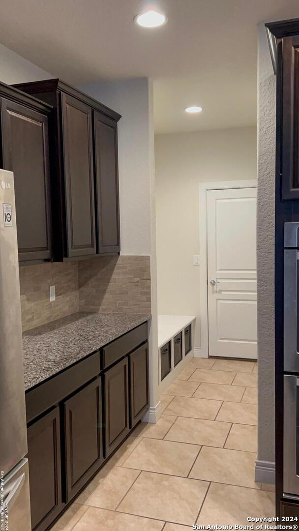 interior space featuring light tile patterned flooring