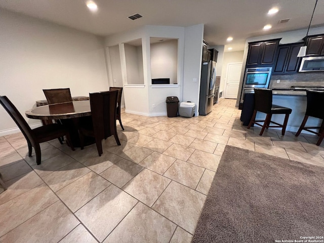 dining room featuring light tile patterned floors