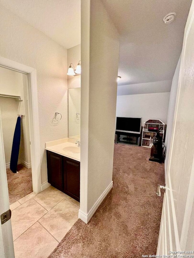 bathroom with tile patterned flooring and vanity