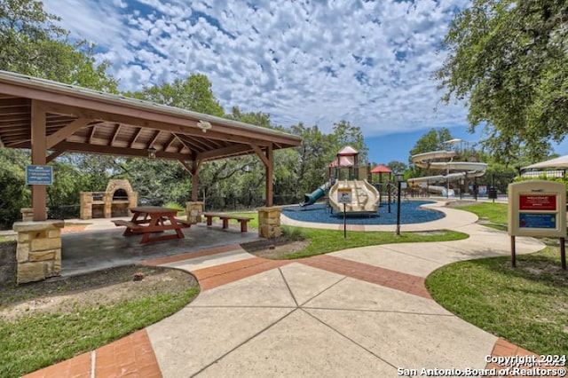 surrounding community featuring a gazebo and a playground