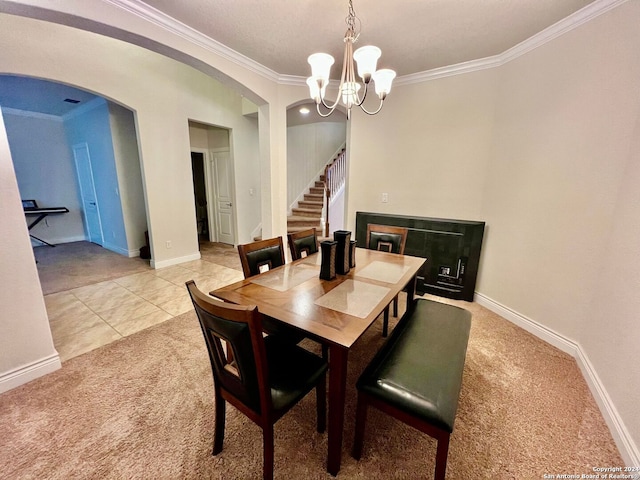 dining area featuring light tile patterned floors, crown molding, and a notable chandelier