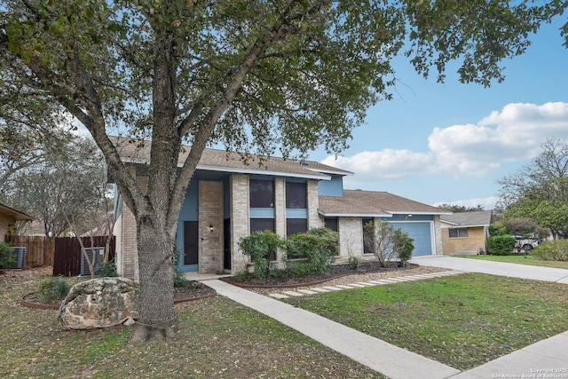 view of front of home featuring a front yard and a garage