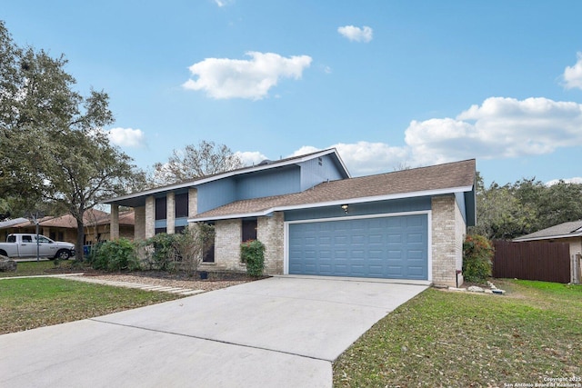 view of front of house featuring a front yard and a garage