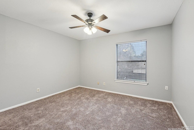 empty room featuring ceiling fan and carpet floors