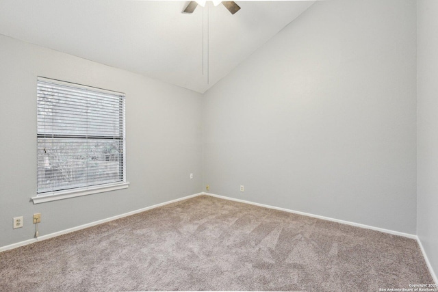 carpeted empty room with ceiling fan and lofted ceiling