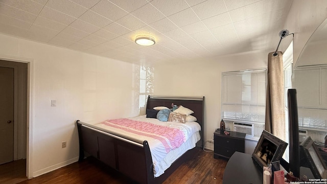 bedroom featuring dark hardwood / wood-style flooring