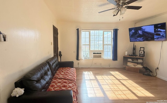 living room with ceiling fan and light wood-type flooring