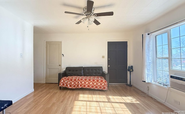 sitting room with light wood-type flooring and ceiling fan