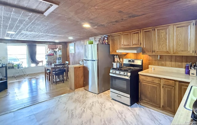 kitchen featuring appliances with stainless steel finishes and wooden ceiling