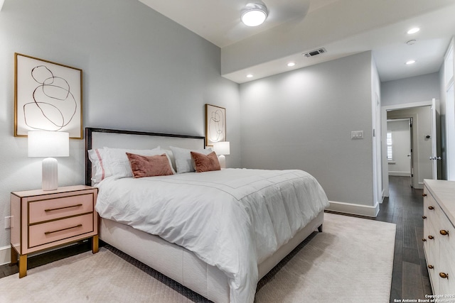 bedroom with wood-type flooring