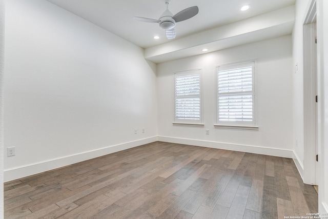 spare room featuring ceiling fan and hardwood / wood-style floors