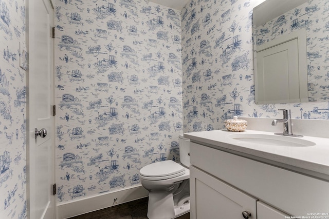 bathroom with vanity and toilet