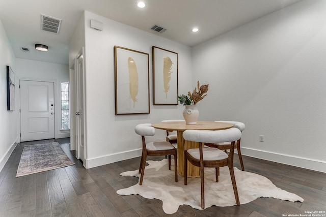 dining area with dark hardwood / wood-style floors