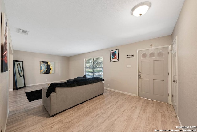 living room with light hardwood / wood-style floors