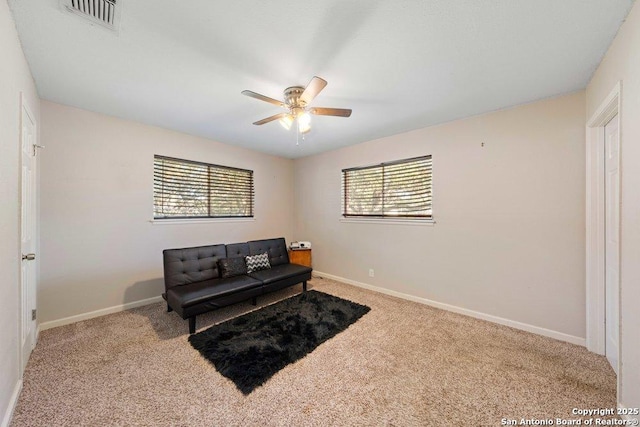 sitting room featuring ceiling fan and light colored carpet