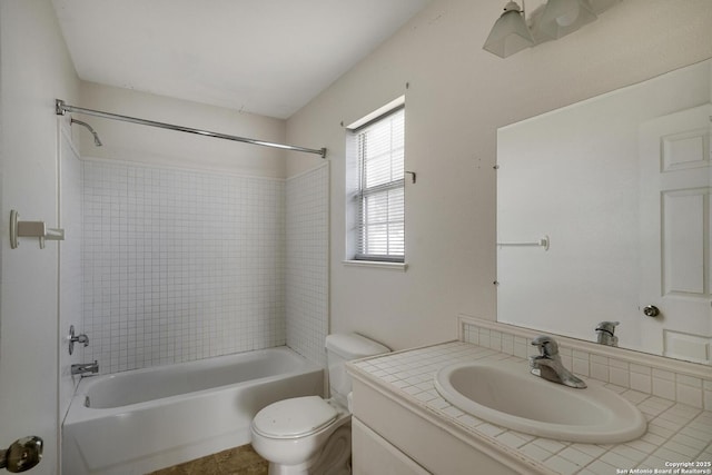 full bathroom with shower / tub combination, tile patterned floors, vanity, and toilet