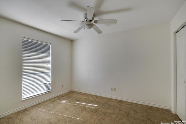 spare room featuring ceiling fan