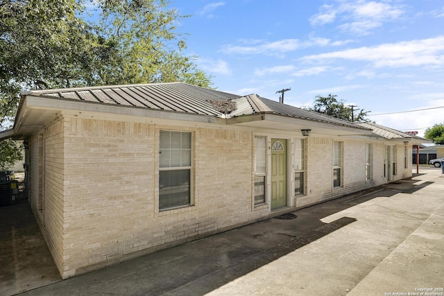 view of side of home featuring a patio area