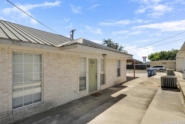 view of side of property featuring central AC