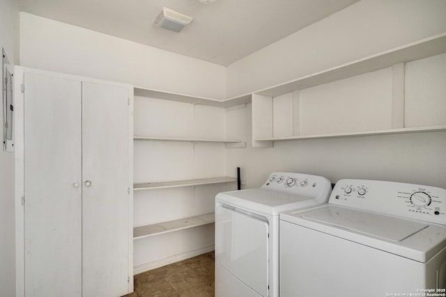 laundry area with washing machine and dryer