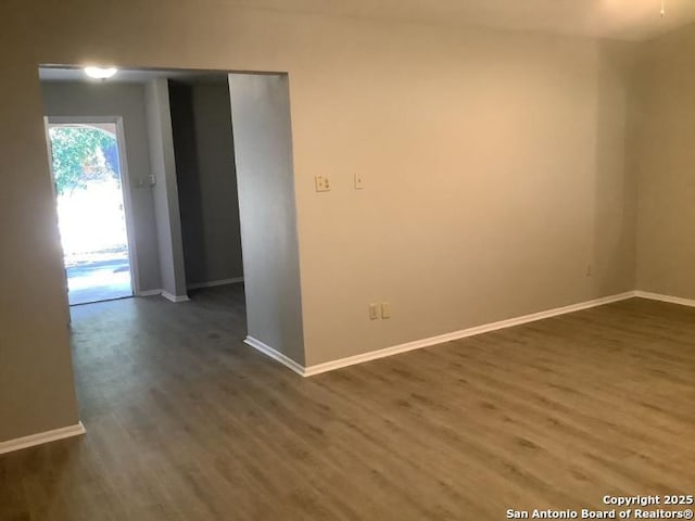 unfurnished room with hardwood / wood-style flooring