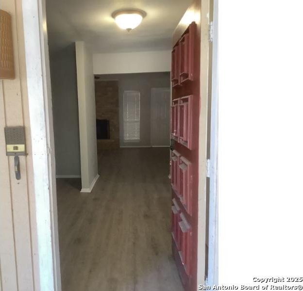 hall featuring dark wood-type flooring