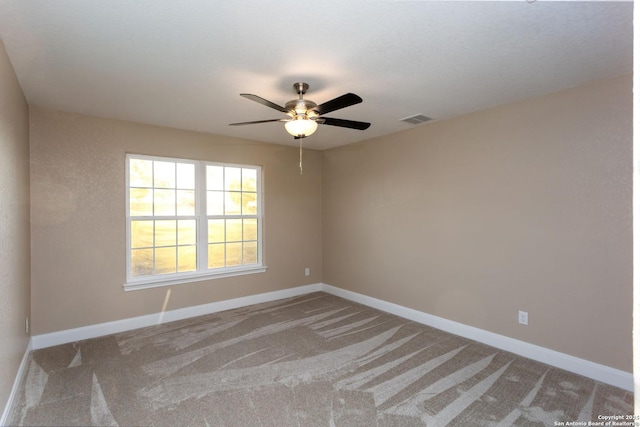 carpeted empty room with ceiling fan