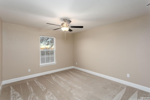 unfurnished room with carpet and ceiling fan