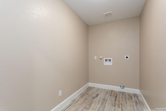 laundry room featuring washer hookup and electric dryer hookup