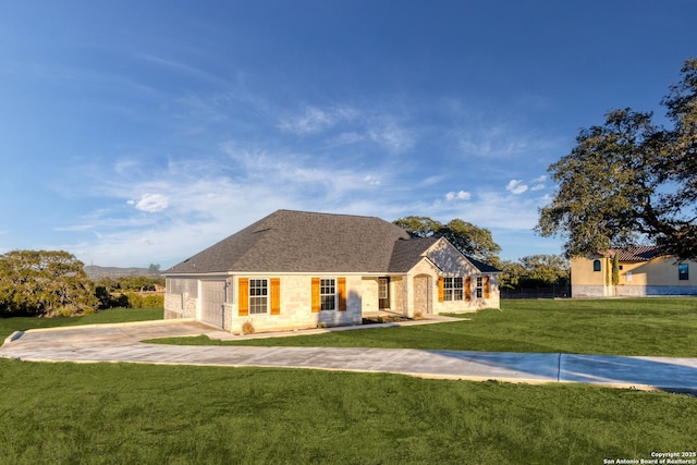 view of front of house with a garage and a front yard