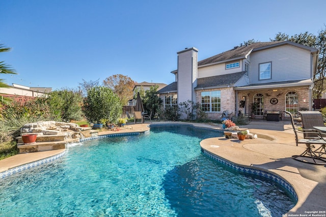 view of pool featuring a patio and pool water feature