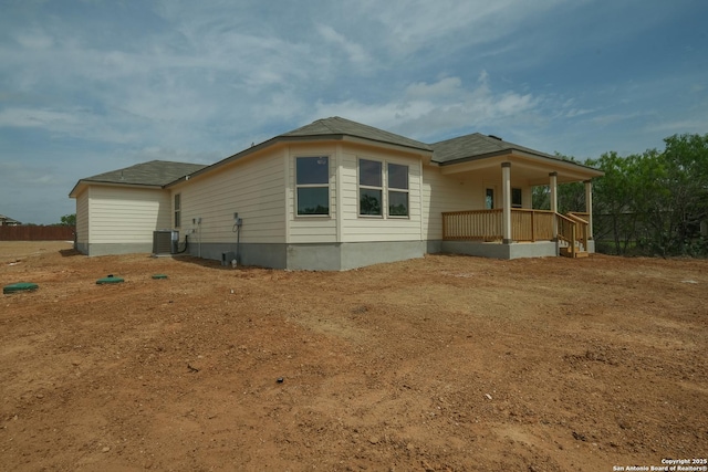view of home's exterior with covered porch and central air condition unit
