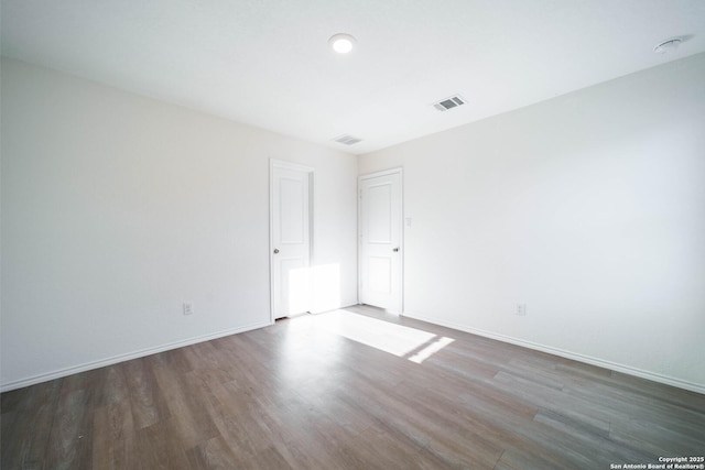 empty room featuring dark hardwood / wood-style floors