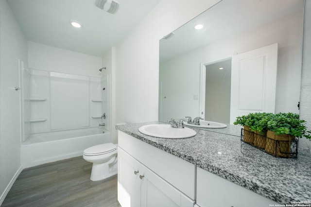 full bathroom with hardwood / wood-style floors, vanity, toilet, and bathing tub / shower combination