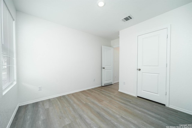 unfurnished bedroom featuring light hardwood / wood-style flooring