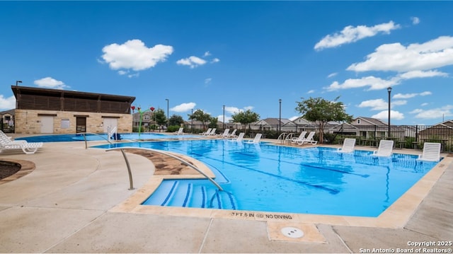 view of swimming pool featuring a patio