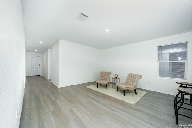 sitting room featuring light hardwood / wood-style flooring