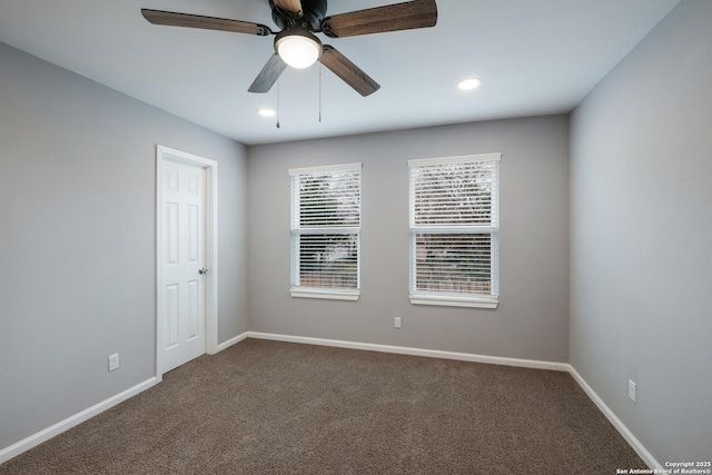 carpeted empty room featuring ceiling fan