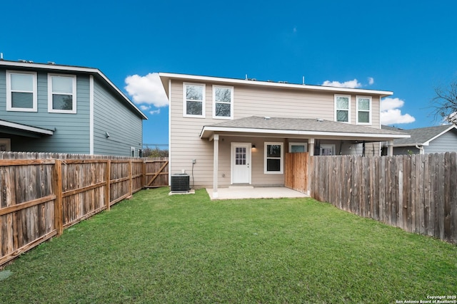 back of property featuring a patio, central AC unit, and a lawn