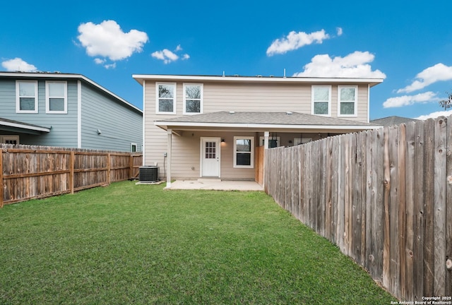 rear view of house featuring central AC unit, a patio area, and a lawn