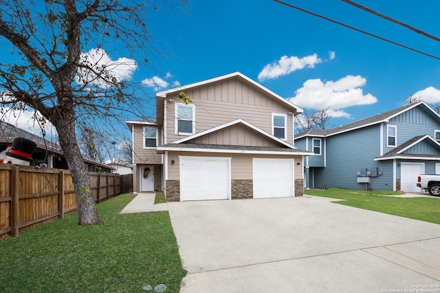 view of front of home with a garage and a front yard