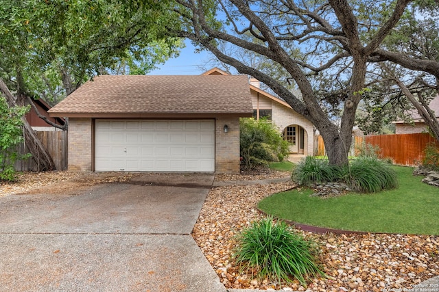 ranch-style home featuring a garage