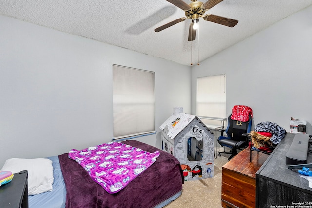 carpeted bedroom featuring lofted ceiling, ceiling fan, and a textured ceiling