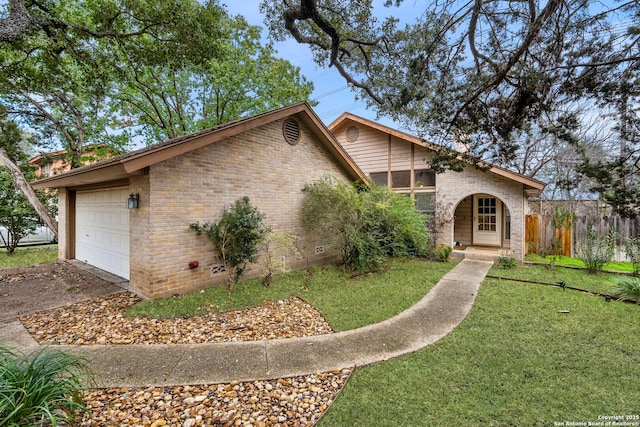 view of front facade featuring a front yard and a garage