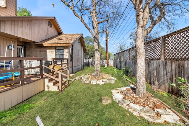 view of yard with a wooden deck