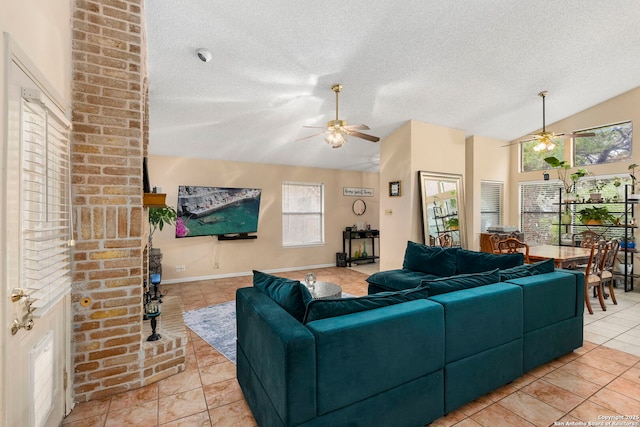 tiled living room with a textured ceiling and lofted ceiling