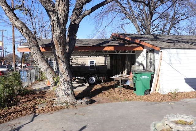 view of home's exterior with a carport