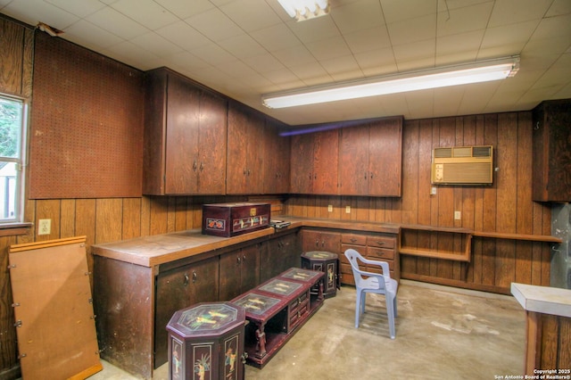 interior space featuring a wall mounted air conditioner and wooden walls