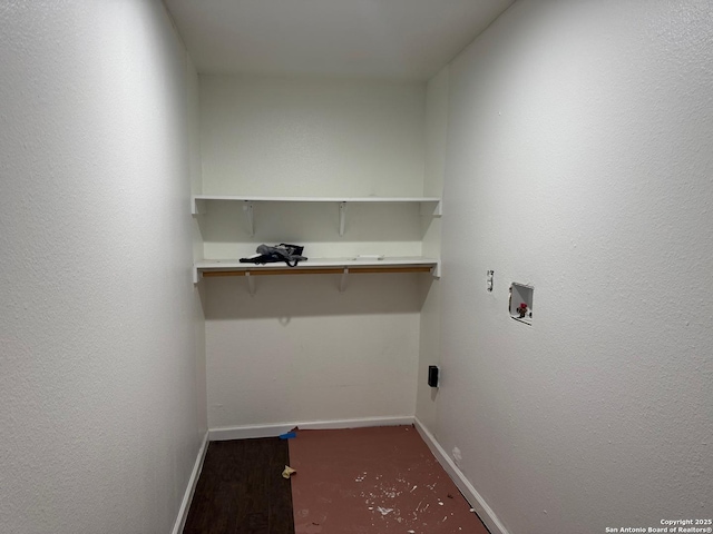 clothes washing area featuring washer hookup and dark hardwood / wood-style floors